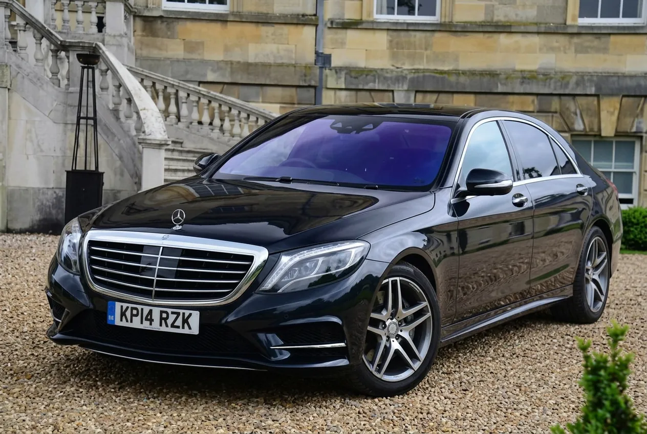Black S-Class Mercedes waiting outside a grand country house