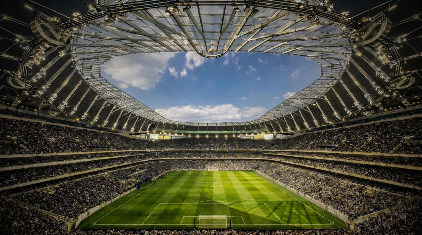 Packed Premier League stadium seen from high in the stand under the open roof